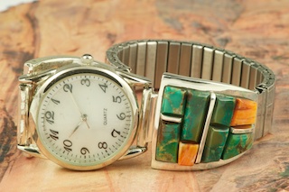 Genuine Turquoise and Spiny Oyster Shell inlaid between ribbons of Sterling Silver. Beautiful Hand Carved Stones.  Mens quartz watch with expandable band. Designed by Navajo Artist Calvin Begay. Signed.